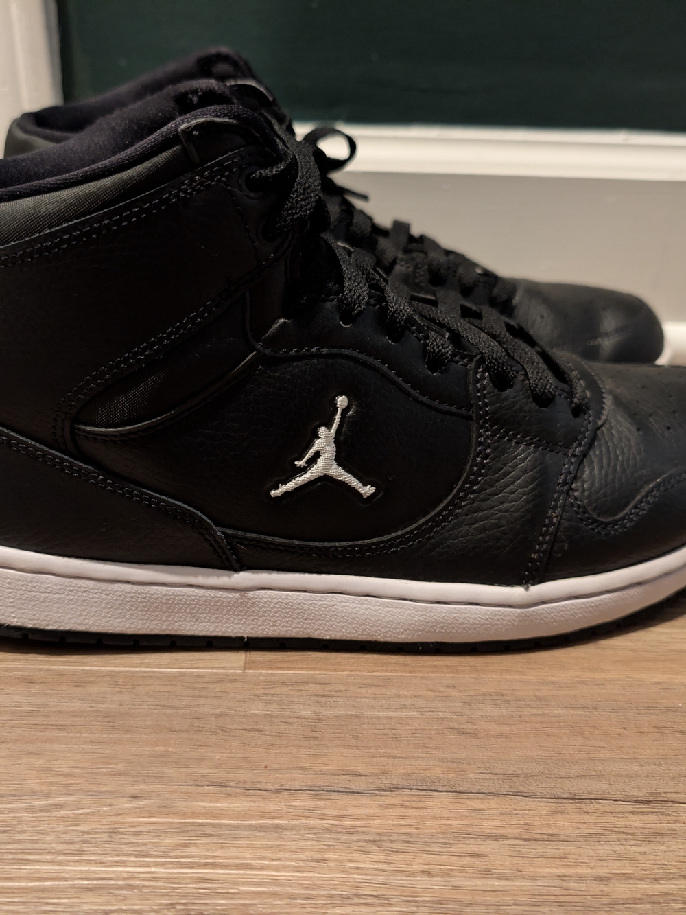 Jordan Men’s Black and White High-Top Sneakers